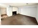 Cozy living room with a classic fireplace and neutral carpeting, ideal for relaxation and gatherings at 5846 Par Four Ct, Lithonia, GA 30038