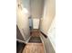 Carpeted stairs to upper level with window at landing at 5846 Par Four Ct, Lithonia, GA 30038