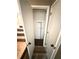 Under-stair storage offers practical space for organizing household items and cleaning supplies at 5846 Par Four Ct, Lithonia, GA 30038