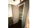An open linen closet provides lots of shelving for storage of towels and sundries at 5846 Par Four Ct, Lithonia, GA 30038
