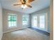 Relaxing bedroom with neutral walls, ceiling fan, and access to the outdoor deck through glass doors at 1451 Brays Mill Trce, Lawrenceville, GA 30044