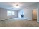 Large bedroom with a ceiling fan, and adjoined by the bathroom and the walk-in closet at 1451 Brays Mill Trce, Lawrenceville, GA 30044