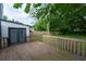 Wooden deck with railing leads out to the backyard at 1451 Brays Mill Trce, Lawrenceville, GA 30044