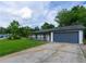 Wide driveway leads up to a charming single-story home with an attached garage and cozy porch at 1451 Brays Mill Trce, Lawrenceville, GA 30044