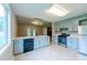 Open kitchen boasts blue cabinets, stainless steel appliances, and a view of the living area at 1451 Brays Mill Trce, Lawrenceville, GA 30044