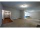 Open-concept living room featuring a view of the kitchen at 1451 Brays Mill Trce, Lawrenceville, GA 30044