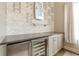 Bar area featuring a wine refrigerator and modern countertop at 976 Memorial Se Walk, Atlanta, GA 30316
