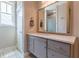 Bathroom with a granite vanity top, modern fixtures, and a view of the shower at 976 Memorial Se Walk, Atlanta, GA 30316