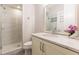 Bathroom features marble countertop vanity and tiled walk-in shower at 976 Memorial Se Walk, Atlanta, GA 30316