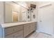 Bathroom with a granite vanity top, large mirror, modern fixtures, and a television at 976 Memorial Se Walk, Atlanta, GA 30316