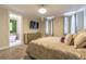 Bedroom featuring plush carpet, a ceiling fan, ensuite bathroom and a flat screen television at 976 Memorial Se Walk, Atlanta, GA 30316
