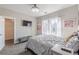 Bright bedroom featuring large windows, TV, and comfortable gray bedding at 976 Memorial Se Walk, Atlanta, GA 30316