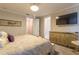 Bedroom featuring a ceiling fan, an ensuite bathroom, and a flat screen television at 976 Memorial Se Walk, Atlanta, GA 30316