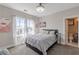 This is a bedroom with neutral colors, a large window, and an attached bathroom at 976 Memorial Se Walk, Atlanta, GA 30316