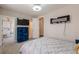 A modern bedroom featuring a mounted television and plenty of storage at 976 Memorial Se Walk, Atlanta, GA 30316