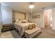 Bedroom with a decorative headboard, chandelier, and upholstered bench at 976 Memorial Se Walk, Atlanta, GA 30316