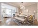 Open floor plan combines dining area with modern chandelier and adjacent living room at 976 Memorial Se Walk, Atlanta, GA 30316