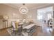 Dining area with modern chandelier adjacent to a cozy living room at 976 Memorial Se Walk, Atlanta, GA 30316