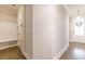 Bright entryway features coat rack with bench and storage, next to a front door at 976 Memorial Se Walk, Atlanta, GA 30316