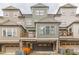 Rear view of attractive townhomes featuring private balconies, garages, and brick accents at 976 Memorial Se Walk, Atlanta, GA 30316