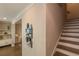 Hallway with art and staircase that leads to other rooms with hardwood floors at 976 Memorial Se Walk, Atlanta, GA 30316