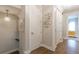Hallway with hardwood floors, a decorative lighting fixture and modern wall art at 976 Memorial Se Walk, Atlanta, GA 30316