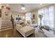 Bright living room featuring hardwood floors, staircase, decorative fireplace and modern decor at 976 Memorial Se Walk, Atlanta, GA 30316