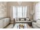 Chic living room showcasing a modern chandelier, comfortable seating, and elegant decor with natural light at 976 Memorial Se Walk, Atlanta, GA 30316