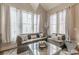 Bright living room with large windows, plush seating, and stylish decor at 976 Memorial Se Walk, Atlanta, GA 30316