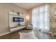 Cozy living room boasts a decorative fireplace, hardwood floors, and natural light at 976 Memorial Se Walk, Atlanta, GA 30316