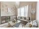 Cozy living room with a stylish chandelier, wine storage, and comfortable seating, perfect for entertaining at 976 Memorial Se Walk, Atlanta, GA 30316