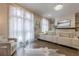 Open-concept living room with hardwood floors, large windows, and modern decorative fireplace at 976 Memorial Se Walk, Atlanta, GA 30316