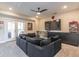 A cozy living room with a large gray sectional sofa and a wall-mounted TV at 976 Memorial Se Walk, Atlanta, GA 30316