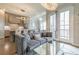 Stylish living room open to kitchen and patio, showcasing comfortable seating and modern decor at 976 Memorial Se Walk, Atlanta, GA 30316