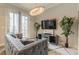 Cozy living room with a large TV, decorative plants, and stylish furnishings creating a cozy atmosphere at 976 Memorial Se Walk, Atlanta, GA 30316