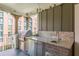 Outdoor kitchen on a balcony featuring a granite countertop and built-in stainless steel grill at 976 Memorial Se Walk, Atlanta, GA 30316