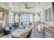 Relaxing covered patio with a ceiling fan, an outdoor kitchen, and views of the surrounding buildings at 976 Memorial Se Walk, Atlanta, GA 30316