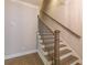 Elegant staircase with hardwood steps, white risers, and a dark metal railing at 976 Memorial Se Walk, Atlanta, GA 30316