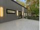 Cantilevered patio overlooking the wooded lot and the modern standing seam exterior at 1153 Dawn View Nw Ln, Atlanta, GA 30327