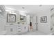 Bright bathroom featuring a double vanity with marble countertops and two mirrors above at 1153 Dawn View Nw Ln, Atlanta, GA 30327