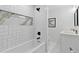 Modern bathroom with white subway tile shower, black fixtures, and a double vanity at 1153 Dawn View Nw Ln, Atlanta, GA 30327