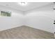 Neat and clean white bedroom with tile floors, bright lighting, and a window at 1153 Dawn View Nw Ln, Atlanta, GA 30327