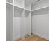 Walk-in closet with custom built in shelving units at 1153 Dawn View Nw Ln, Atlanta, GA 30327