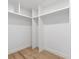 Spacious closet with custom shelving and wood flooring at 1153 Dawn View Nw Ln, Atlanta, GA 30327