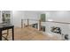 Modern foyer featuring wood flooring and views to the exterior through large windows at 1153 Dawn View Nw Ln, Atlanta, GA 30327