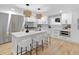 Modern kitchen with an island, marble countertops, and stainless steel appliances at 1153 Dawn View Nw Ln, Atlanta, GA 30327
