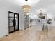 Bright, open kitchen and dining area featuring modern lighting and stainless appliances at 1153 Dawn View Nw Ln, Atlanta, GA 30327