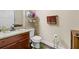 Cozy bathroom features granite counters, wood floors, and stylish decor at 2212 Nichols Valley Drive, Dacula, GA 30019