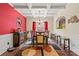 Formal dining room features coffered ceiling, hardwood floors, and stylish chandelier at 2212 Nichols Valley Drive, Dacula, GA 30019