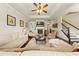 Bright living room features hardwood floors, a fireplace and plenty of seating space at 2212 Nichols Valley Drive, Dacula, GA 30019